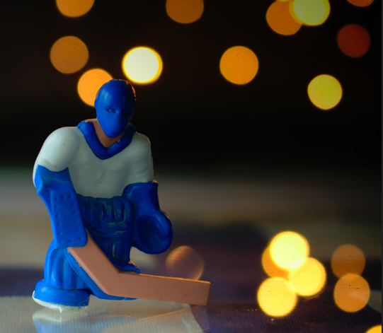 ice hockey figurine with bokeh lighting
